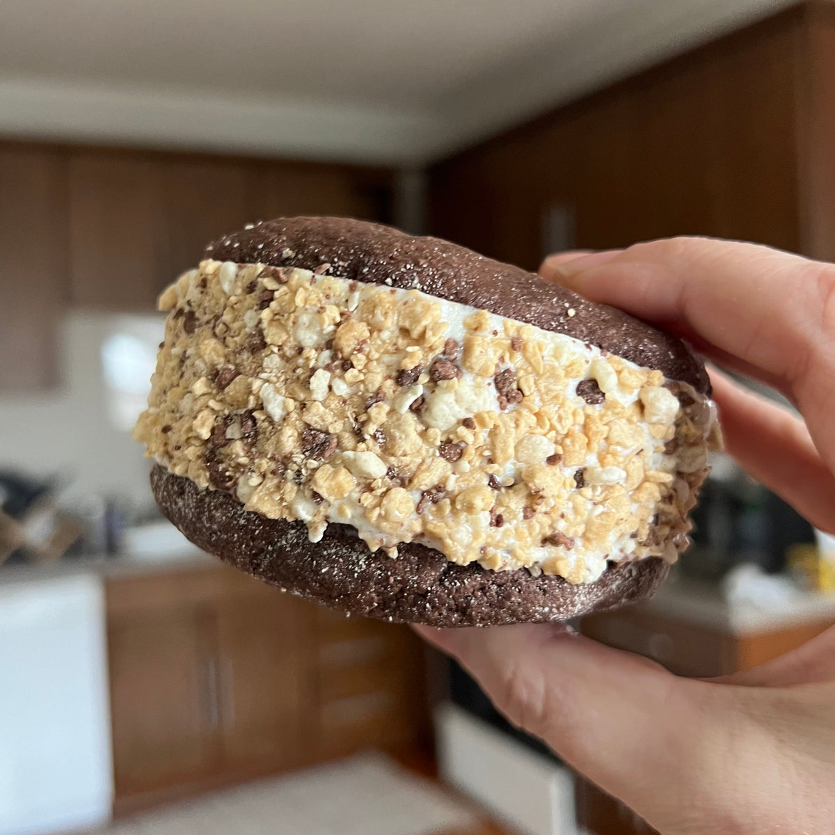 True Scoops homemade ice cream sandwich with cookie dough crumbs